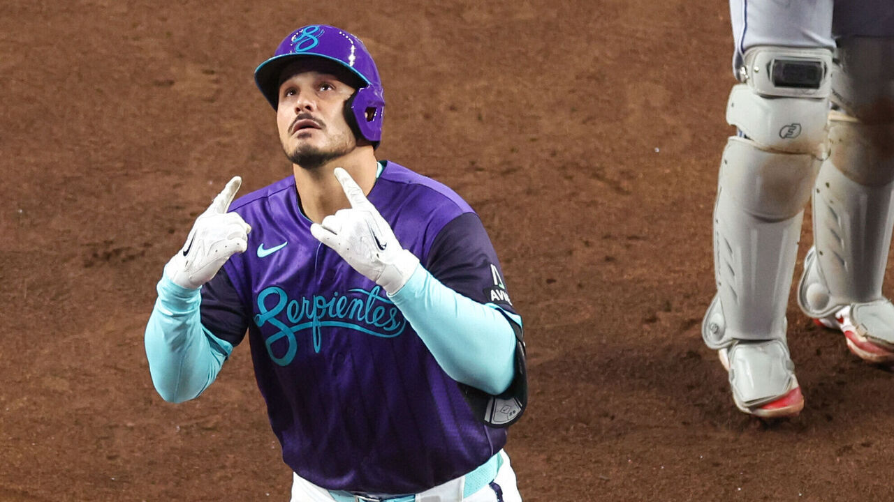 PHOENIX, AZ - APRIL 17: Nolan Arenado #28 of the Arizona Diamondbacks celebrates at home plate after hitting a solo home run in the fourth inning during the game between the Toronto Blue Jays and the Arizona Diamondbacks at Chase Field on Friday, April 17, 2026 in Phoenix, Arizona.
