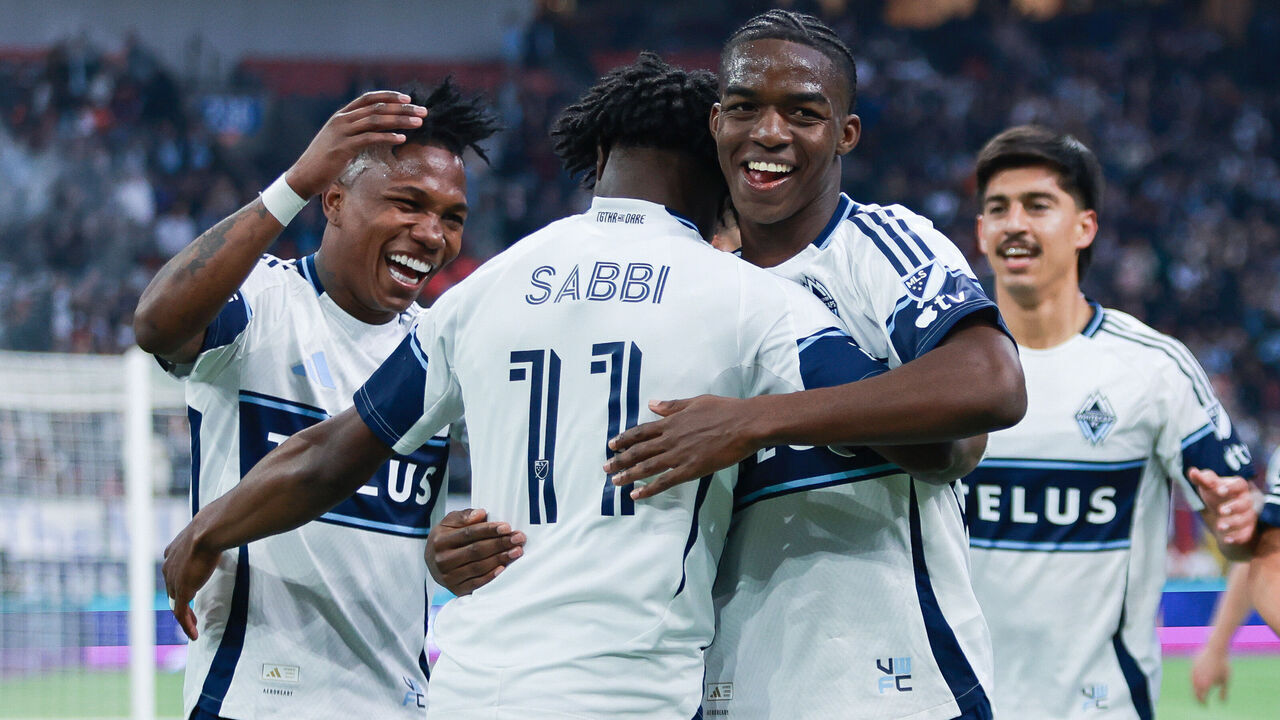 VANCOUVER, BRITISH COLUMBIA - APRIL 17: Emmanuel Sabbi #11 of the Vancouver Whitecaps FC celebrates with teammates Edier Ocampo #18 and Bruno Caicedo #14 after the second goal during the match against Sporting Kansas City at BC Place on April 17, 2026 in Vancouver, British Columbia.
