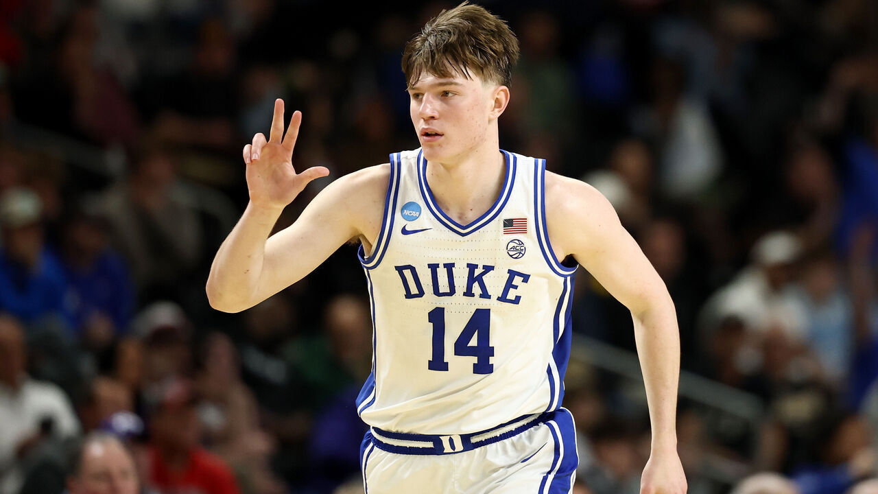 GREENVILLE, SOUTH CAROLINA - MARCH 19: Nikolas Khamenia #14 of the Duke Blue Devils reacts after a three-point basket against the Siena Saints during the second half in the first round of the 2026 NCAA Men's Basketball Tournament at Bon Secours Wellness Arena on March 19, 2026 in Greenville, South Carolina.