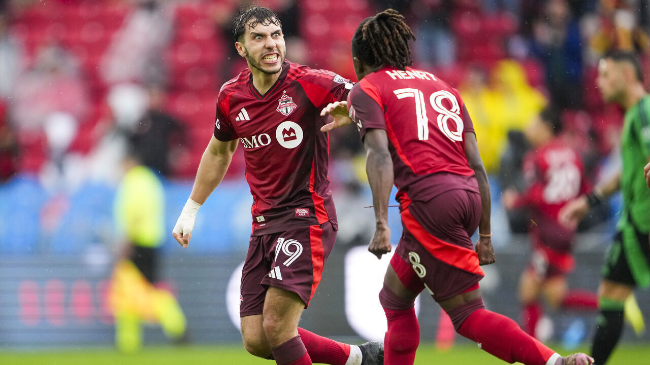 TORONTO, CANADA - APRIL 18: Kobe Franklin #19 of the Toronto FC celebrates his goal with Malik Henry #78 against the Austin FC during the second half of their MLS soccer match at BMO Field on April 18, 2026 in Toronto, Ontario, Canada.