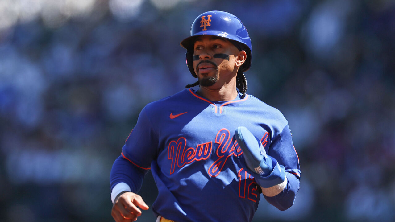 CHICAGO, ILLINOIS - APRIL 18: Francisco Lindor #12 of the New York Mets runs to third base during the first inning against the Chicago Cubs at Wrigley Field on April 18, 2026 in Chicago, Illinois.