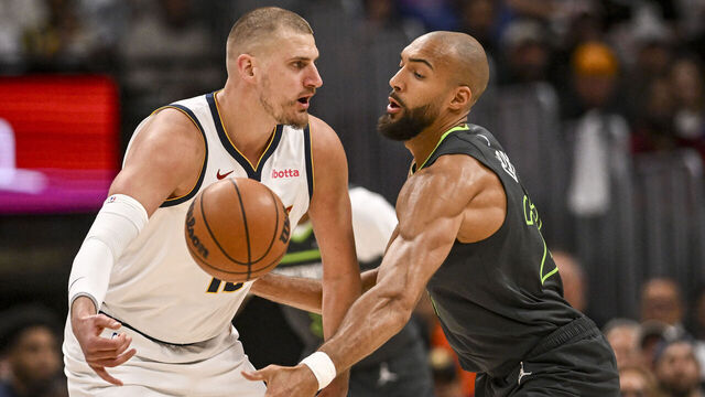 DENVER , CO - APRIL 18: Rudy Gobert (27) of the Minnesota Timberwolves defends Nikola Jokic (15) of the Denver Nuggets during the first quarter at Ball Arena in Denver, Colorado on Saturday, April 18, 2026.