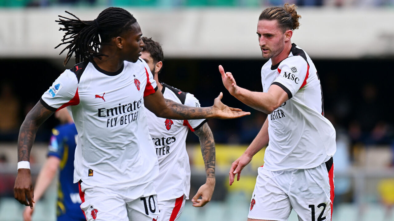 VERONA, ITALY - APRIL 19: Adrien Rabiot of AC Milan celebrates scoring his team's first goal with teammate Rafael Leao during the Serie A match between Hellas Verona FC and AC Milan at Stadio Marcantonio Bentegodi on April 19, 2026 in Verona, Italy.