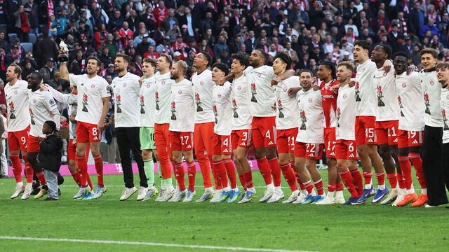 FC Bayern Munich's team celebrates after winning the German first division Bundesliga football match between FC Bayern Munich and VfB Stuttgart as well as the Bundesliga title in Munich, southern Germany, on April 19, 2026. Harry Kane scored his 32nd goal of the campaign as Bayern Munich cruised to a 4-2 home win over Stuttgart and claim a record-extending 35th Bundesliga title. / DFL REGULATIONS PROHIBIT ANY USE OF PHOTOGRAPHS AS IMAGE SEQUENCES AND/OR QUASI-VIDEO