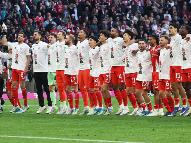 FC Bayern Munich's team celebrates after winning the German first division Bundesliga football match between FC Bayern Munich and VfB Stuttgart as well as the Bundesliga title in Munich, southern Germany, on April 19, 2026. Harry Kane scored his 32nd goal of the campaign as Bayern Munich cruised to a 4-2 home win over Stuttgart and claim a record-extending 35th Bundesliga title. / DFL REGULATIONS PROHIBIT ANY USE OF PHOTOGRAPHS AS IMAGE SEQUENCES AND/OR QUASI-VIDEO