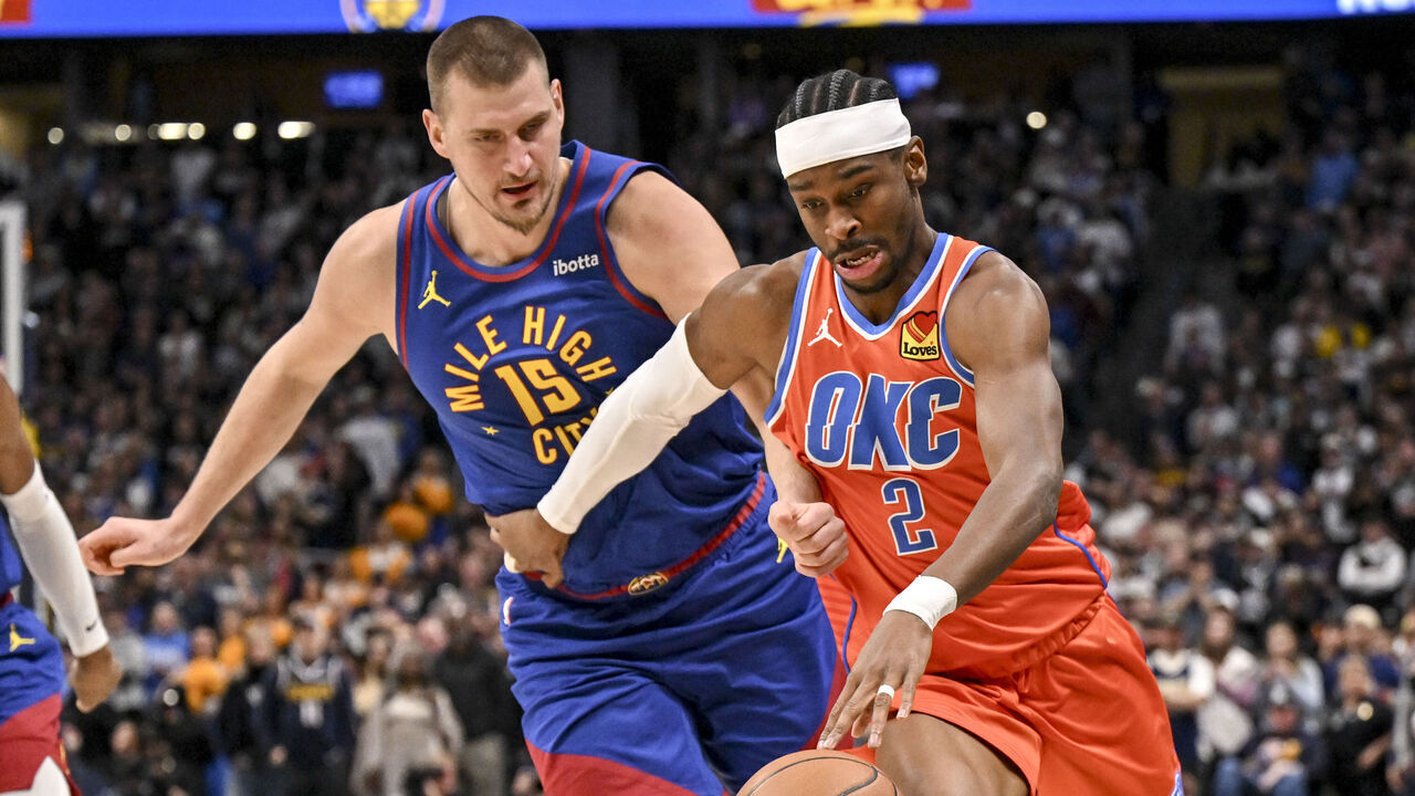 DENVER , CO - FEBRUARY 1: Nikola Jokic (15) of the Denver Nuggets defends Shai Gilgeous-Alexander (2) of the Oklahoma City Thunder during the first quarter at Ball Arena in Denver, Colorado on Sunday, February 1, 2026.