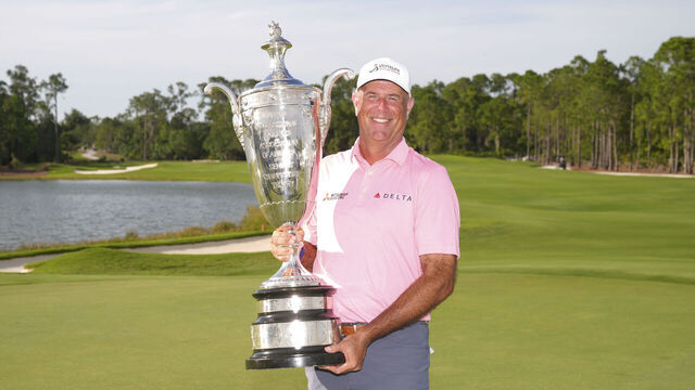 BRADENTON, FL - APRIL 19: Stewart Cink poses with the Alfred S. Bourne Trophy after winning the Senior PGA Championship at The Concession Golf Club on Sunday, April 19, 2026 in Bradenton, Florida.