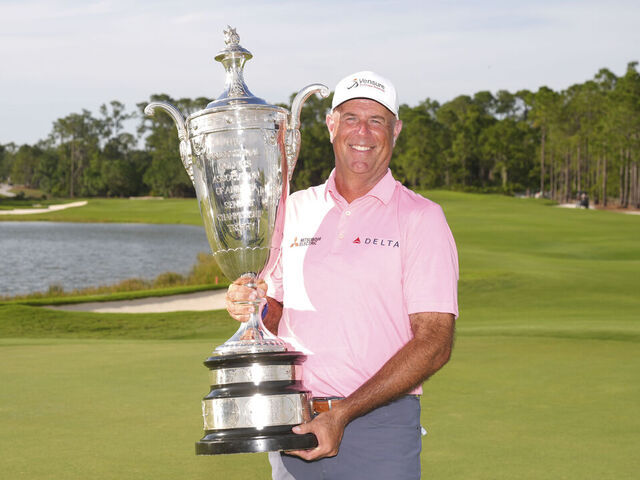 BRADENTON, FL - APRIL 19: Stewart Cink poses with the Alfred S. Bourne Trophy after winning the Senior PGA Championship at The Concession Golf Club on Sunday, April 19, 2026 in Bradenton, Florida.