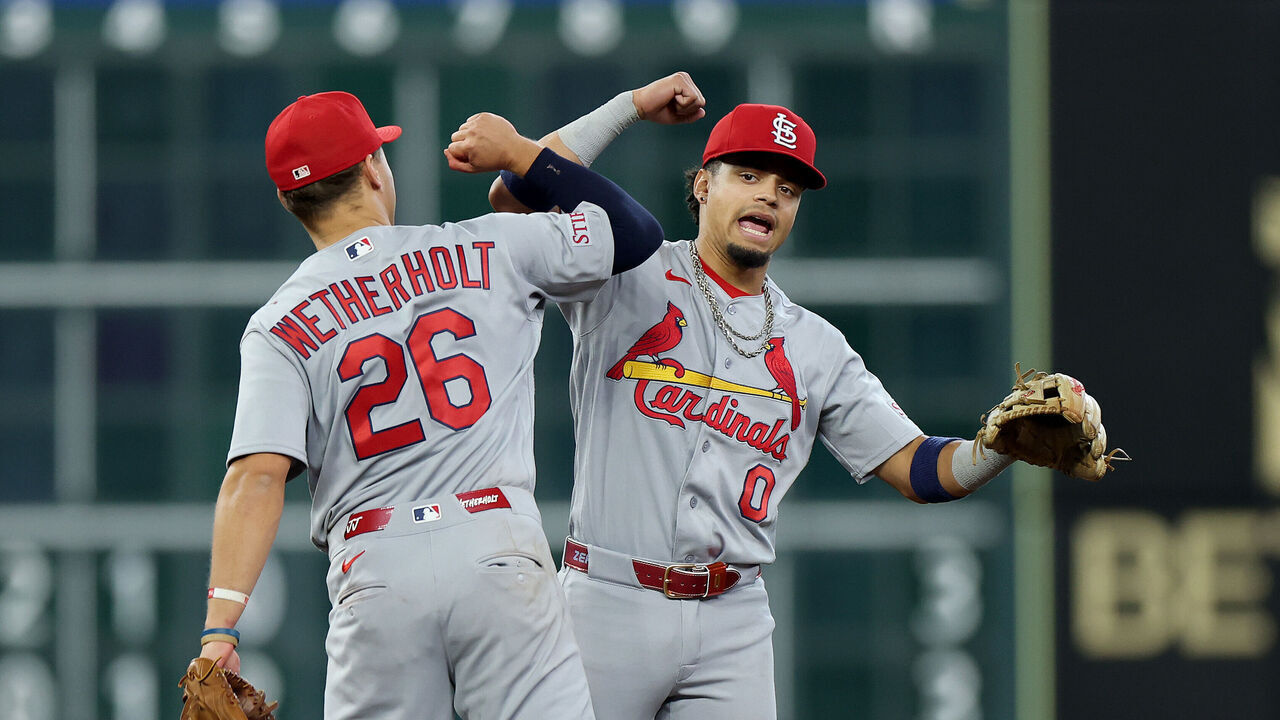 HOUSTON, TEXAS - APRIL 19: Masyn Winn #0 and JJ Wetherholt #26 of the St. Louis Cardinals celebrate after defeating the Houston Astros in the game at Daikin Park on April 19, 2026 in Houston, Texas.