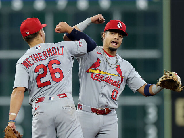 HOUSTON, TEXAS - APRIL 19: Masyn Winn #0 and JJ Wetherholt #26 of the St. Louis Cardinals celebrate after defeating the Houston Astros in the game at Daikin Park on April 19, 2026 in Houston, Texas.