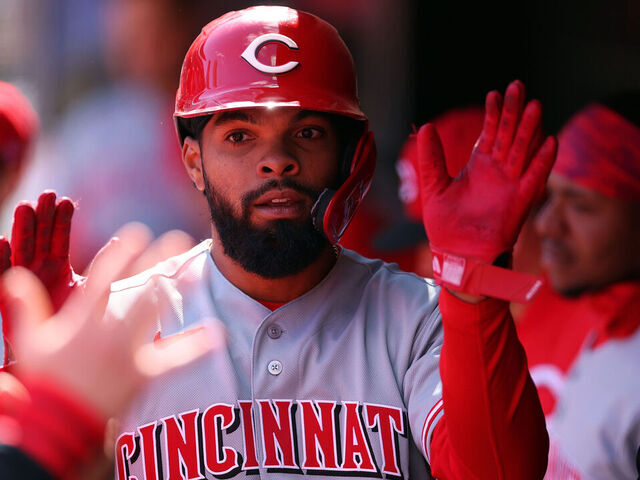 MINNEAPOLIS, MINNESOTA - APRIL 18: Rece Hinds #57 of the Cincinnati Reds celebrates scoring a run on an RBI single by teammate Elly de la Cruz #44 (not pictured) against the Minnesota Twins in the seventh inning at Target Field on April 18, 2026 in Minneapolis, Minnesota. The Reds defeated the Twins 5-4.