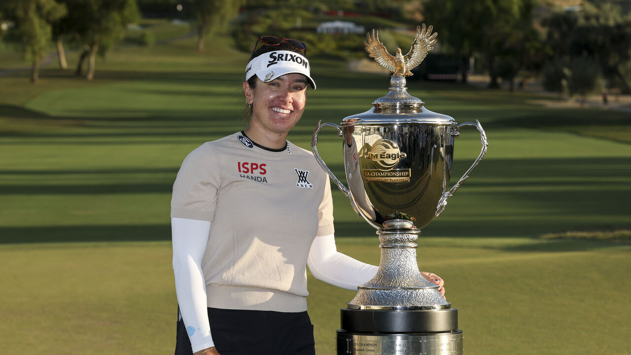TARZANA, CALIFORNIA - APRIL 19: Hannah Green of Australia poses with the trophy after winning the JM Eagle LA Championship presented by Plastpro at El Caballero Country Club on April 19, 2026 in Tarzana, California.