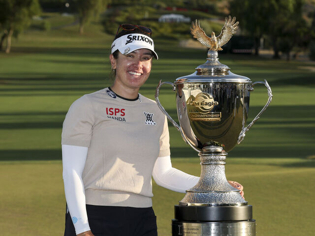 TARZANA, CALIFORNIA - APRIL 19: Hannah Green of Australia poses with the trophy after winning the JM Eagle LA Championship presented by Plastpro at El Caballero Country Club on April 19, 2026 in Tarzana, California.