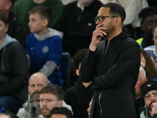 Chelsea's English head coach Liam Rosenior looks on during the English Premier League football match between Chelsea and Manchester United at Stamford Bridge in London on April 18, 2026. / RESTRICTED TO EDITORIAL USE. No use with unauthorized audio, video, data, fixture lists, club/league logos or 'live' services. Online in-match use limited to 120 images. An additional 40 images may be used in extra time. No video emulation. Social media in-match use limited to 120 images. An additional 40 images may be used in extra time. No use in betting publications, games or single club/league/player publications. /