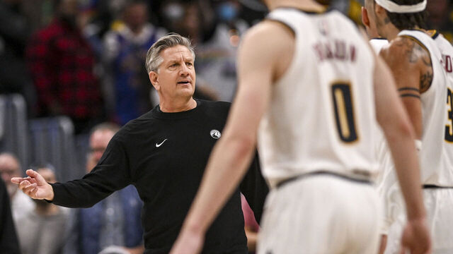 DENVER , CO - APRIL 18: Chris Finch of the Minnesota Timberwolves gets involved as Nikola Jokic (15) of the Denver Nuggets speaks to officials during the fourth quarter of the Nuggets' 116-105 win at Ball Arena in Denver, Colorado on Saturday, April 18, 2026. The Nuggets took a 1-0 lead in their best-of-seven series.
