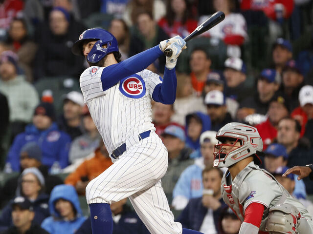 CHICAGO, ILLINOIS - APRIL 20: Dansby Swanson #7 of the Chicago Cubs hits a three-run home run in the second inning against the Philadelphia Phillies at Wrigley Field on April 20, 2026 in Chicago, Illinois.