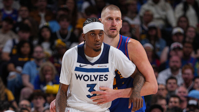 DENVER, CO - APRIL 20: Jaden McDaniels #3 of the Minnesota Timberwolves and Nikola Jokic #15 of the Denver Nuggets look on during the game during Round One Game Two of the 2026 NBA Playoffs on April 20, 2026 at Ball Arena in Denver, Colorado. NOTE TO USER: User expressly acknowledges and agrees that, by downloading and/or using this Photograph, user is consenting to the terms and conditions of the Getty Images License Agreement. Mandatory Copyright Notice: Copyright 2026 NBAE
