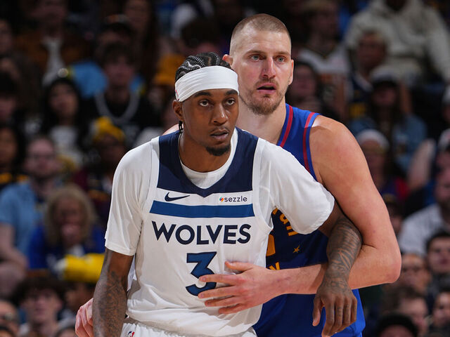 DENVER, CO - APRIL 20: Jaden McDaniels #3 of the Minnesota Timberwolves and Nikola Jokic #15 of the Denver Nuggets look on during the game during Round One Game Two of the 2026 NBA Playoffs on April 20, 2026 at Ball Arena in Denver, Colorado. NOTE TO USER: User expressly acknowledges and agrees that, by downloading and/or using this Photograph, user is consenting to the terms and conditions of the Getty Images License Agreement. Mandatory Copyright Notice: Copyright 2026 NBAE