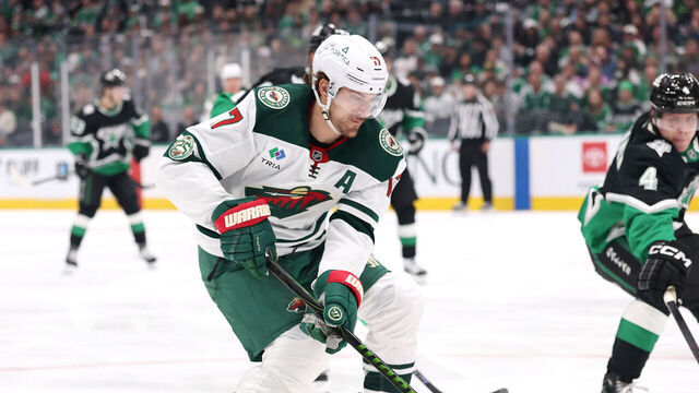 DALLAS, TEXAS - APRIL 20: Marcus Foligno #17 of the Minnesota Wild advances the puck under pressure from Miro Heiskanen #4 of the Dallas Stars \d2p of Game Two of the First Round of the 2026 Stanley Cup Playoffs at American Airlines Center on April 20, 2026 in Dallas, Texas.
