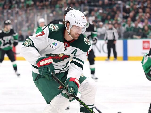 DALLAS, TEXAS - APRIL 20: Marcus Foligno #17 of the Minnesota Wild advances the puck under pressure from Miro Heiskanen #4 of the Dallas Stars \d2p of Game Two of the First Round of the 2026 Stanley Cup Playoffs at American Airlines Center on April 20, 2026 in Dallas, Texas.