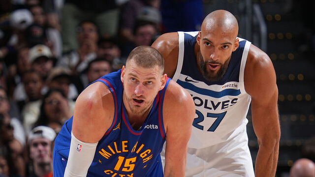 DENVER, CO - APRIL 20: Nikola Jokic #15 of the Denver Nuggets and Rudy Gobert #27 of the Minnesota Timberwolves look on during the game during Round One Game Two of the 2026 NBA Playoffs on April 20, 2026 at Ball Arena in Denver, Colorado. NOTE TO USER: User expressly acknowledges and agrees that, by downloading and/or using this Photograph, user is consenting to the terms and conditions of the Getty Images License Agreement. Mandatory Copyright Notice: Copyright 2026 NBAE