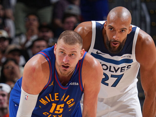 DENVER, CO - APRIL 20: Nikola Jokic #15 of the Denver Nuggets and Rudy Gobert #27 of the Minnesota Timberwolves look on during the game during Round One Game Two of the 2026 NBA Playoffs on April 20, 2026 at Ball Arena in Denver, Colorado. NOTE TO USER: User expressly acknowledges and agrees that, by downloading and/or using this Photograph, user is consenting to the terms and conditions of the Getty Images License Agreement. Mandatory Copyright Notice: Copyright 2026 NBAE