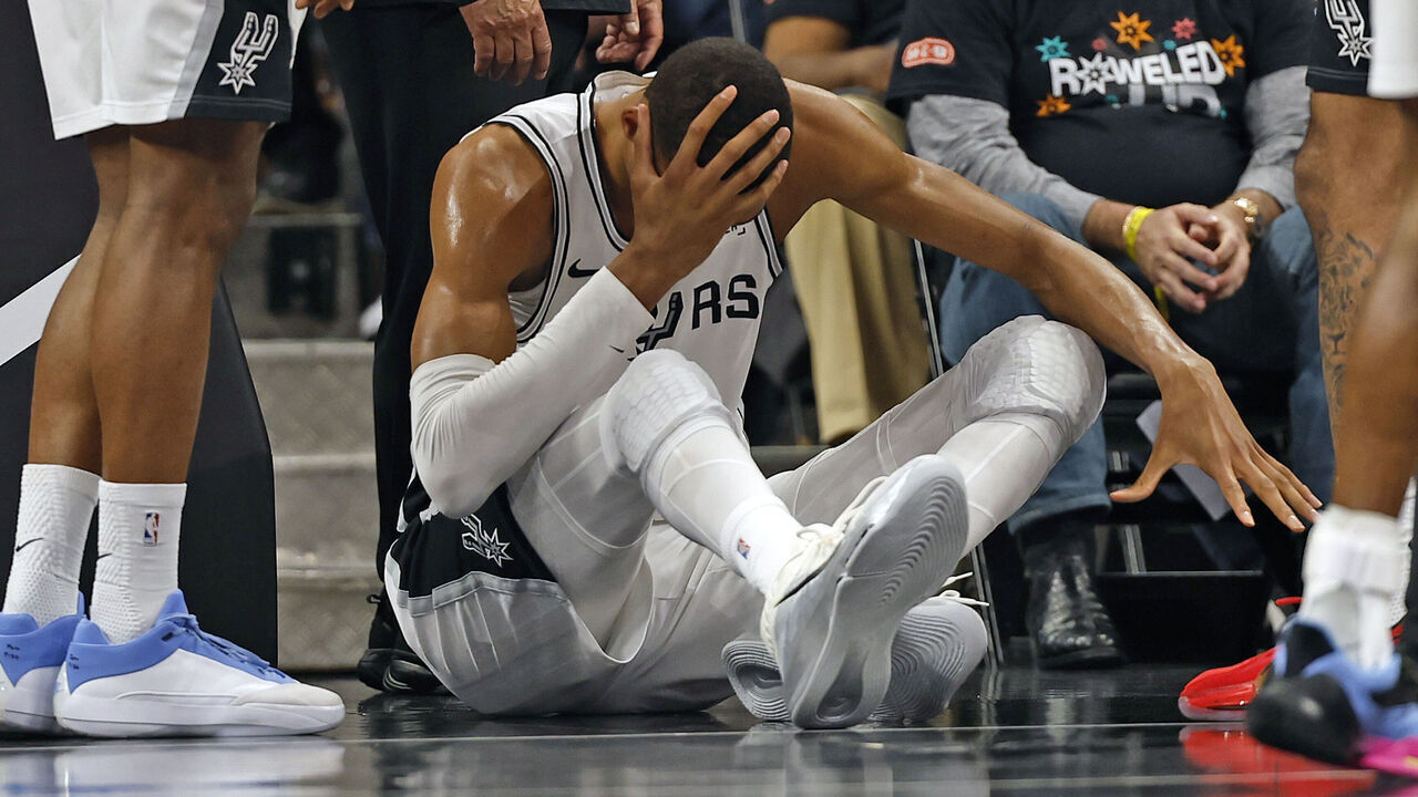 SAN ANTONIO, TX -APRIL 21: Victor Wembanyama #1 of the San Antonio Spurs holds his head after falling to the court against the Portland Trailblazers in the first half of Game Two of the Western Conference First Round NBA Playoffs at Frost Bank Center on April 21, 2026 in San Antonio, Texas. NOTE TO USER: User expressly acknowledges and agrees that, by downloading and or using this photograph, User is consenting to terms and conditions of the Getty Images License Agreement.