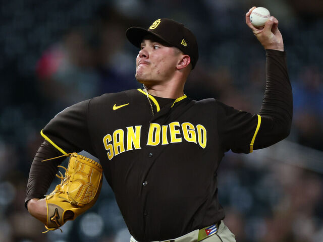 DENVER, CO - APRIL 21: Adrian Morejon #50 of the San Diego Padres delivers a pitch in the ninth inning against the Colorado Rockies at Coors Field on April 21, 2026 in Denver, Colorado.