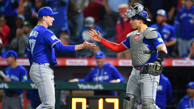ANAHEIM, CA - APRIL 21: Toronto Blue Jays pitcher Louis Varland (77) celebrates with with Toronto Blue Jays catcher Brandon Valenzuela (59) after the MLB game between the Toronto Blue Jays the Los Angeles Angels on April 21, 2026 at Angel Stadium in Anaheim, CA.