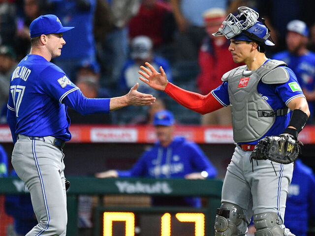 ANAHEIM, CA - APRIL 21: Toronto Blue Jays pitcher Louis Varland (77) celebrates with with Toronto Blue Jays catcher Brandon Valenzuela (59) after the MLB game between the Toronto Blue Jays the Los Angeles Angels on April 21, 2026 at Angel Stadium in Anaheim, CA.