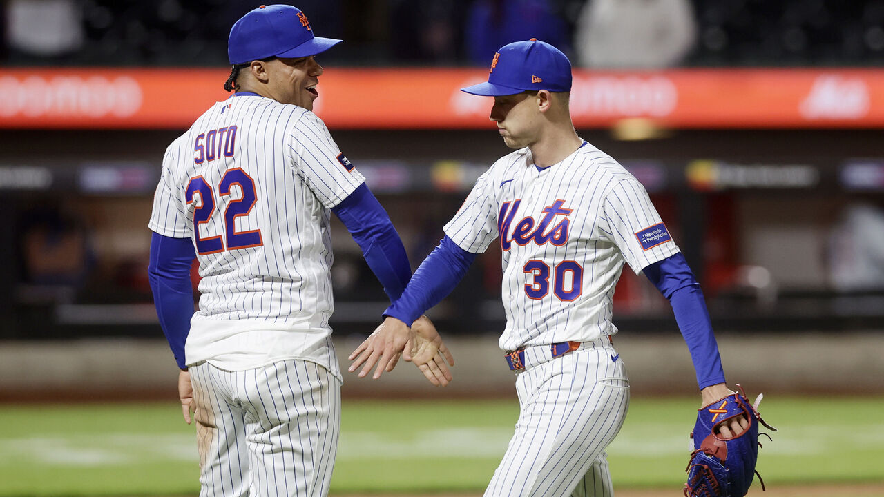 NEW YORK, NEW YORK - APRIL 22: Juan Soto #22 and Luke Weaver #30 of the New York Mets celebrate after defeating the Minnesota Twins at Citi Field on April 22, 2026 in New York City.
