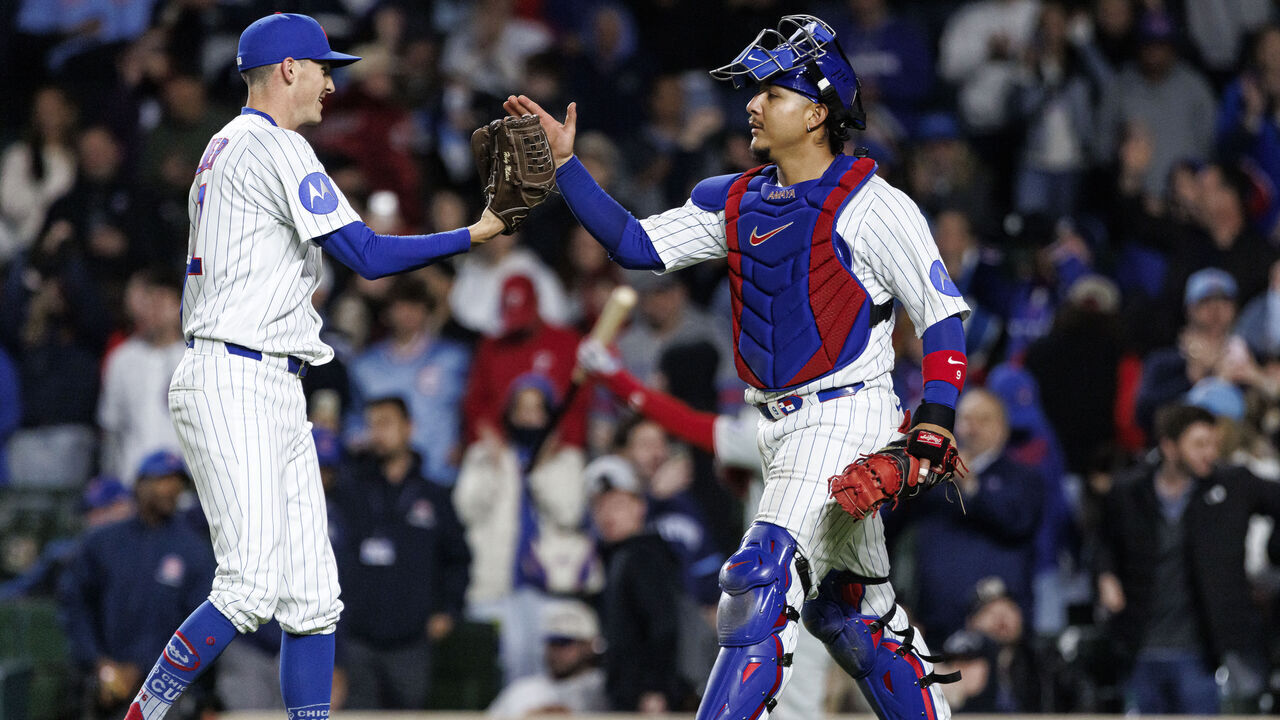 CHICAGO, ILLINOIS - APRIL 22: Hoby Milner #41 and Miguel Amaya #9 of the Chicago Cubs react after the final out of a game between the Philadelphia Phillies and the Chicago Cubs at Wrigley Field on April 22, 2026 in Chicago, Illinois.