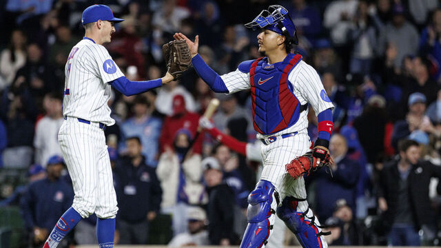 CHICAGO, ILLINOIS - APRIL 22: Hoby Milner #41 and Miguel Amaya #9 of the Chicago Cubs react after the final out of a game between the Philadelphia Phillies and the Chicago Cubs at Wrigley Field on April 22, 2026 in Chicago, Illinois.