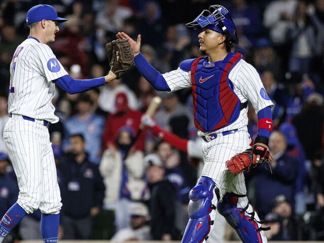 CHICAGO, ILLINOIS - APRIL 22: Hoby Milner #41 and Miguel Amaya #9 of the Chicago Cubs react after the final out of a game between the Philadelphia Phillies and the Chicago Cubs at Wrigley Field on April 22, 2026 in Chicago, Illinois.