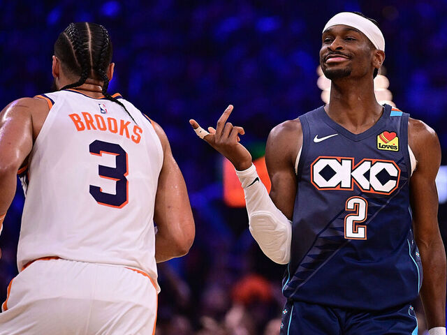 OKLAHOMA CITY, OKLAHOMA - APRIL 22: Shai Gilgeous-Alexander #2 of the Oklahoma City Thunder gestures towards Dillon Brooks #3 of the Phoenix Suns during the first half in Game Two of the Western Conference First Round NBA Playoffs at Paycom Center on April 22, 2026 in Oklahoma City, Oklahoma.