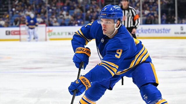BUFFALO, NEW YORK - APRIL 19: Josh Norris #9 of the Buffalo Sabres passes the puck against Marat Khusnutdinov #92 of the Boston Bruins during Game One of the First Round of the 2026 Stanley Cup Playoffs at KeyBank Center on April 19, 2026 in Buffalo, New York.