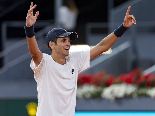 MADRID, SPAIN - APRIL 22: Rafa Jodar of Spain celebrates the victory with a with a dedication to Jude Bellingham presents on the stands at the end of the match against Jesper de Jong of Netherlands during the Mutua Madrid Open 2026 tournament celebrated at La Caja Magica on April 22, 2026 in Madrid, Spain.