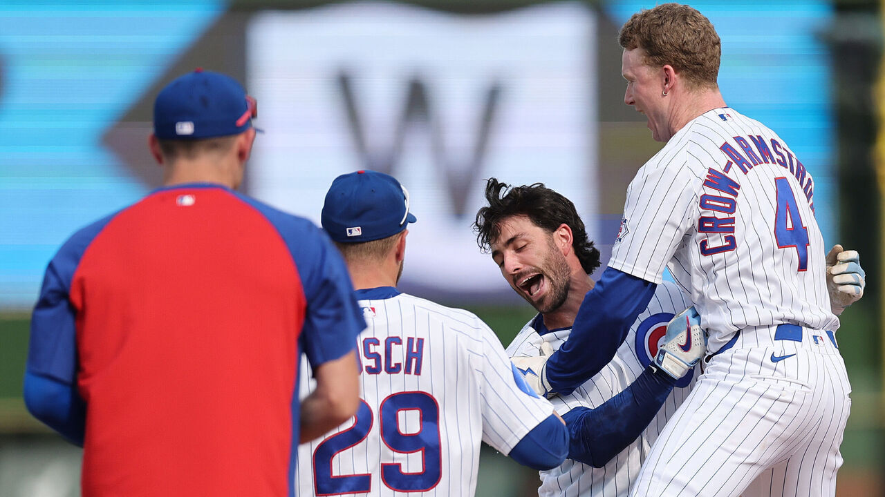CHICAGO, ILLINOIS - APRIL 23: Dansby Swanson #7 of the Chicago Cubs celebrates with teammates after hitting a walk-off single against the Philadelphia Phillies during the tenth inning at Wrigley Field on April 23, 2026 in Chicago, Illinois.