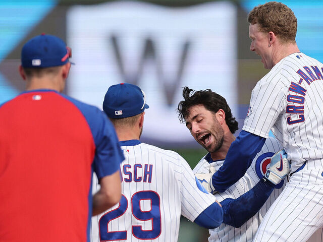 CHICAGO, ILLINOIS - APRIL 23: Dansby Swanson #7 of the Chicago Cubs celebrates with teammates after hitting a walk-off single against the Philadelphia Phillies during the tenth inning at Wrigley Field on April 23, 2026 in Chicago, Illinois.