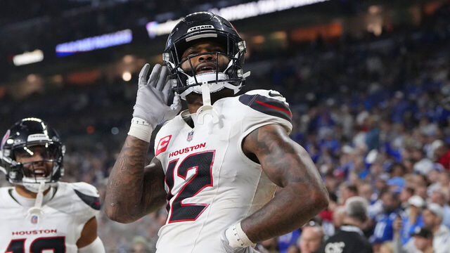 INDIANAPOLIS, INDIANA - NOVEMBER 30: Nico Collins #12 of the Houston Texans celebrates after his rushing touchdown against the Indianapolis Colts during the fourth quarter at Lucas Oil Stadium on November 30, 2025 in Indianapolis, Indiana.