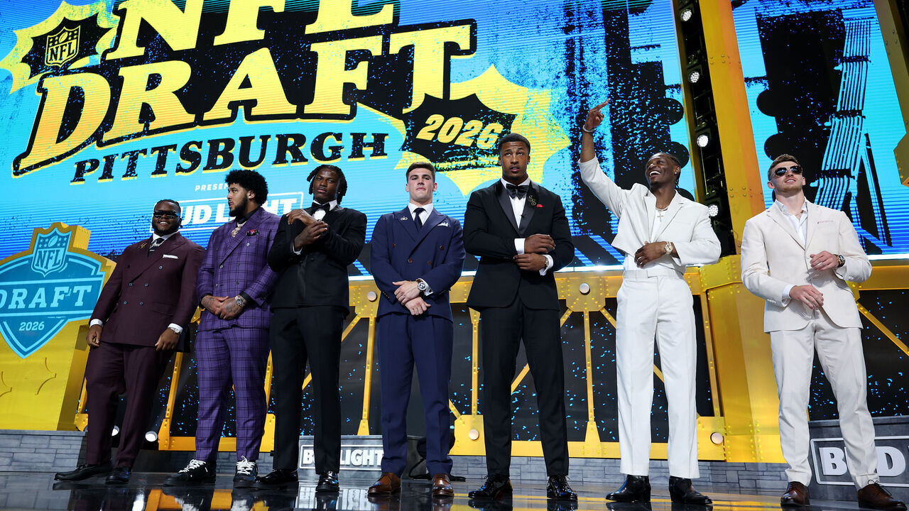 PITTSBURGH, PENNSYLVANIA - APRIL 23: (L-R) Kayden McDonald of Ohio State, Kadyn Proctor of Alabama, Arvell Reese of Ohio State, Ty Simpson of Alabama, Sonny Styles of Ohio State, Carnell Tate of Ohio State and Dillon Thieneman of Oregon pose on stage prior to Round One of the 2026 NFL Draft at Acrisure Stadium on April 23, 2026 in Pittsburgh, Pennsylvania.