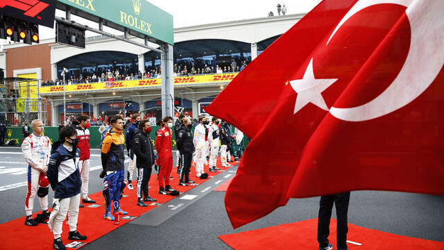 ISTANBUL, TURKEY - OCTOBER 10: The drivers stand for the national anthem on the grid during the F1 Grand Prix of Turkey at Intercity Istanbul Park on October 10, 2021 in Istanbul, Turkey.