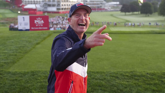 FARMINGDALE, NY - SEPTEMBER 27: Team United States Vice Captain Jim Furyk hypes up the spectators at the first hole grandstand during the 2025 Ryder Cup on the Black Course at Bethpage State Park on Saturday, September 27, 2025 in Farmingdale, New York.