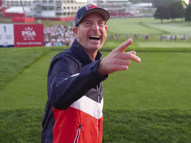 FARMINGDALE, NY - SEPTEMBER 27: Team United States Vice Captain Jim Furyk hypes up the spectators at the first hole grandstand during the 2025 Ryder Cup on the Black Course at Bethpage State Park on Saturday, September 27, 2025 in Farmingdale, New York.