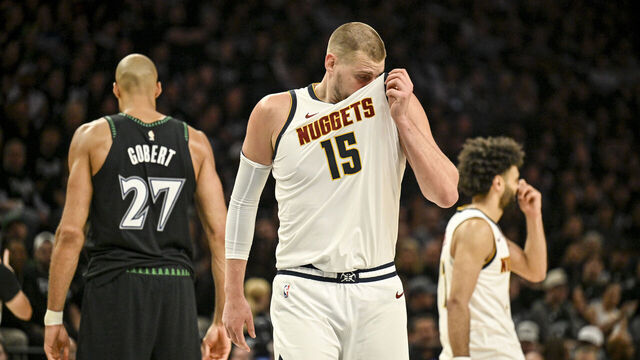 MINNEAPOLIS , MN - APRIL 23: Nikola Jokic (15) of the Denver Nuggets reacts to being fouled by Rudy Gobert (27) of the Minnesota Timberwolves during the fourth quarter of the Timberwolves' 113-96 win at the Target Center in Minneapolis, Minnesota on Thursday, April 23, 2026. Minnesota took a 2-1 best-of-seven series lead.