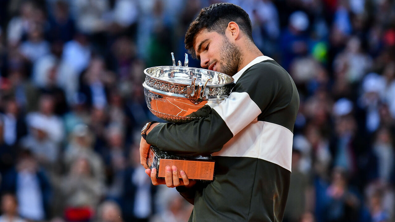 PARIS, FRANCE - JUNE 08: Carlos Alcaraz of Spain holds the Coupe des Mousquetaires trophy following his victory over Jannik Sinner of Italy during the Men’s Singles Final match on Day Fifteen of the 2025 French Open at Roland Garros on June 08, 2025 in Paris, France.