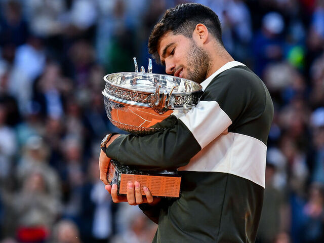 PARIS, FRANCE - JUNE 08: Carlos Alcaraz of Spain holds the Coupe des Mousquetaires trophy following his victory over Jannik Sinner of Italy during the Men’s Singles Final match on Day Fifteen of the 2025 French Open at Roland Garros on June 08, 2025 in Paris, France.
