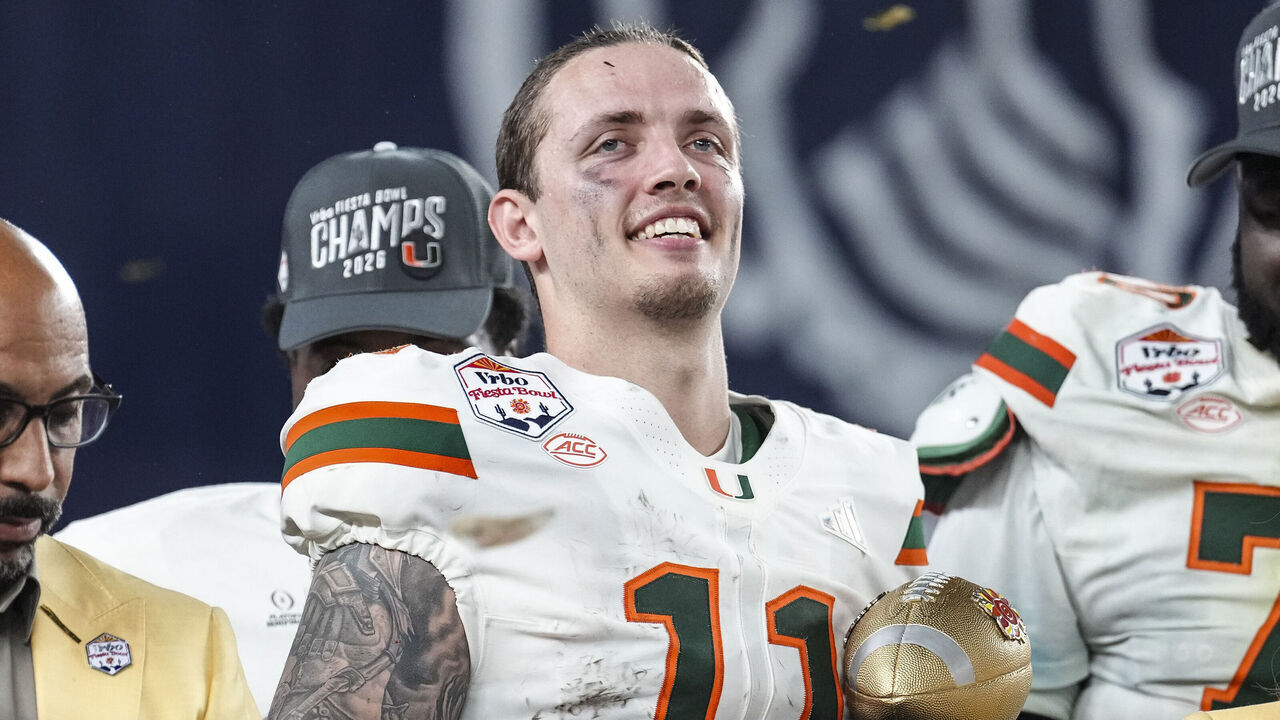 GLENDALE, ARIZONA - JANUARY 8: Carson Beck #11 of the Miami Hurricanes celebrates on stage after the second half of CFP Semifinal Vrbo Fiesta Bowl against the Ole Miss Rebels at State Farm Stadium on January 8, 2026 in Glendale, Arizona.The Miami Hurricanes defeated the Ole Miss Rebels 31-27.