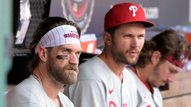 WASHINGTON, DC - MARCH 30: Philadelphia Phillies first baseman Bryce Harper (3) and shortstop Trea Turner (7) sit on the bench during game between the Philadelphia Phillies versus the Washington Nationals on March 30, 2025 at Nationals Park in Washington, D.C.