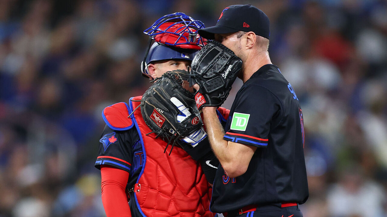 TORONTO, ON - APRIL 24: (L-R) Tyler Heineman #55 of the Toronto Blue Jays speaks to Max Scherzer #31 in the first inning during the game against the Cleveland Guardians at Rogers Centre on April 24, 2025 in Toronto, Ontario, Canada.